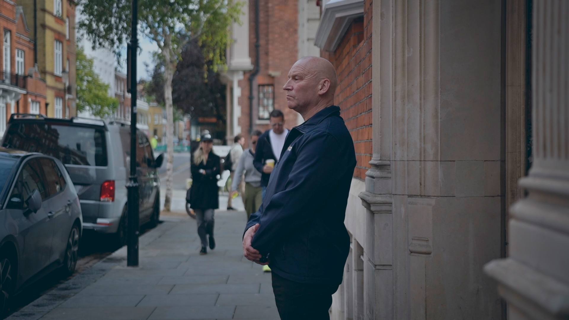 A security officer on patrol in a busy public retail street